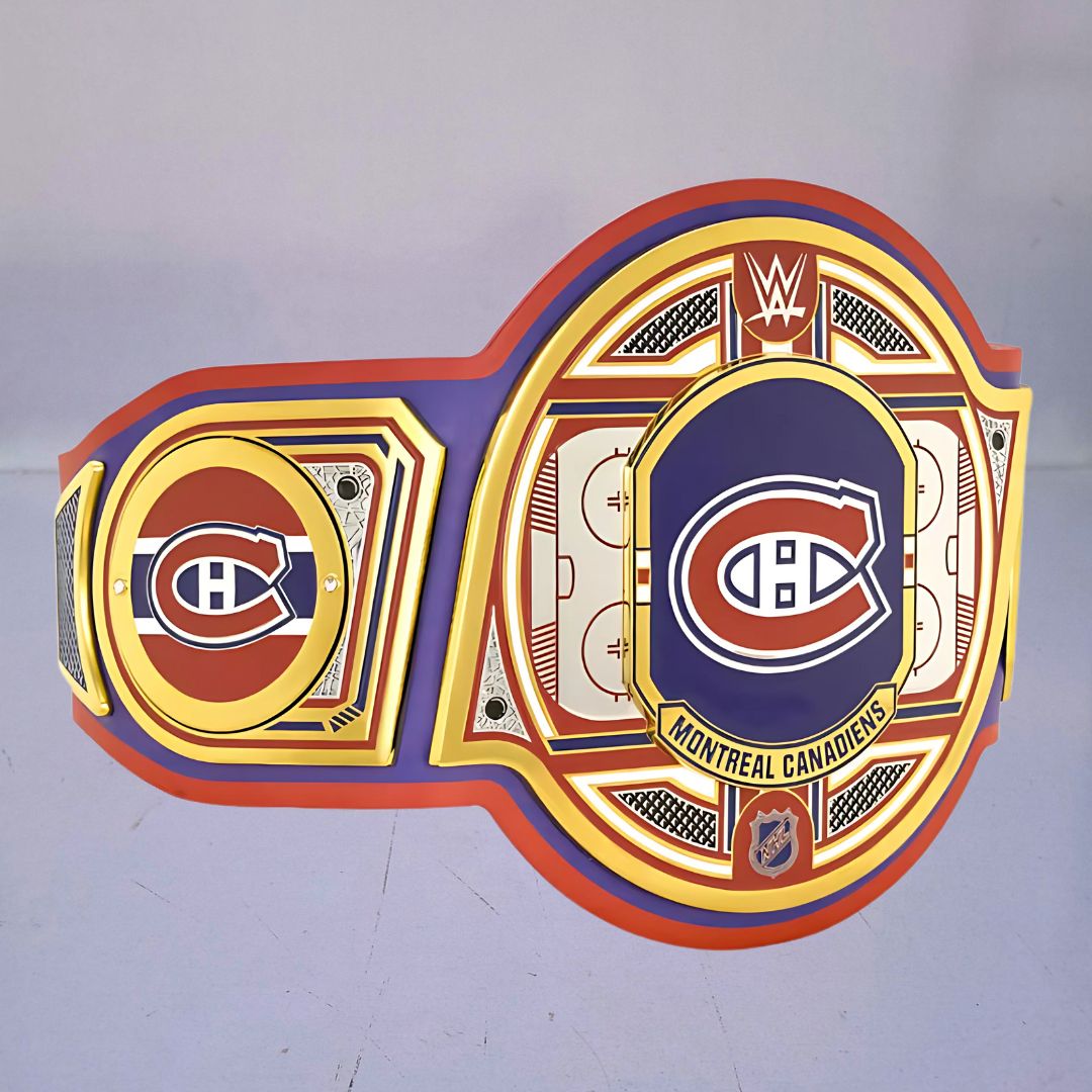 Close-up of the Montreal Canadiens WWE Championship Belt, showcasing red, white, and blue accents.