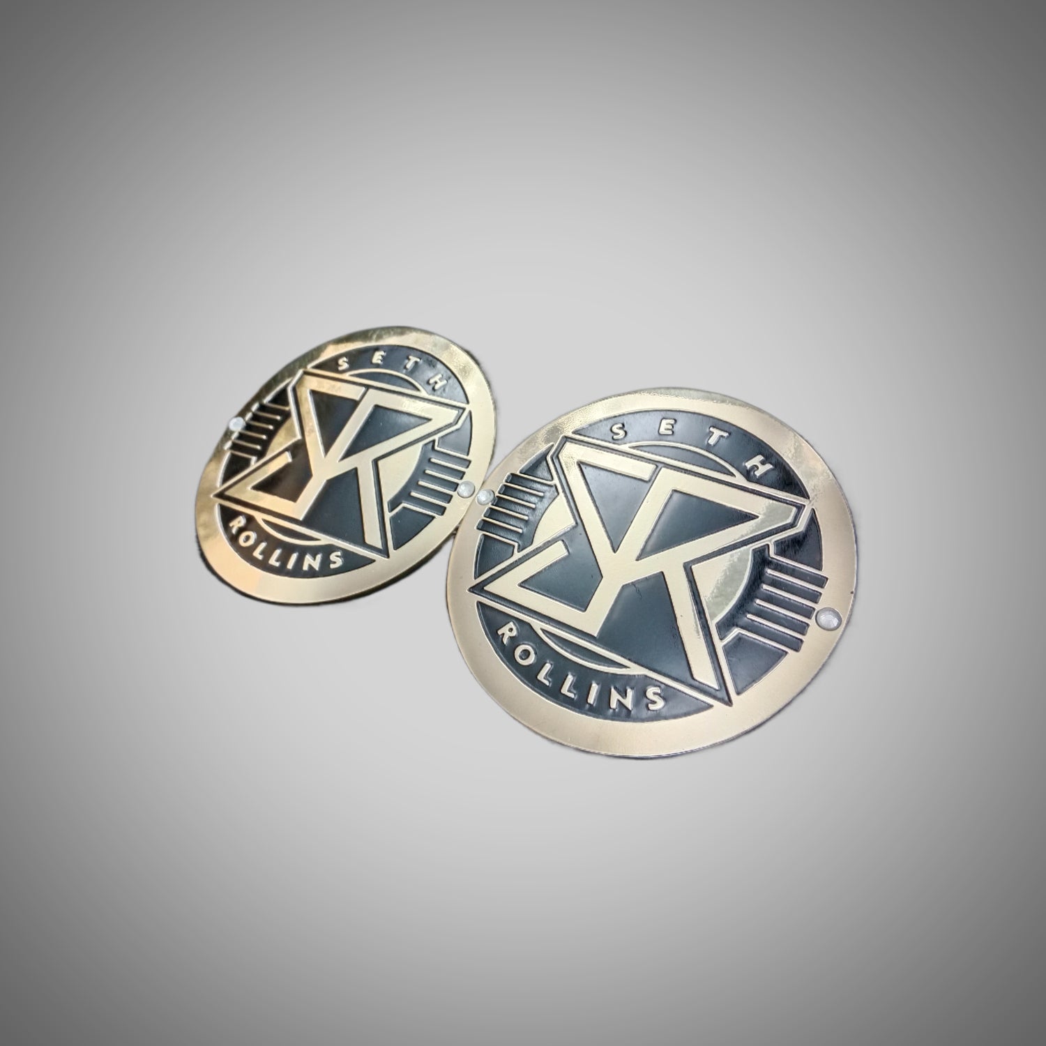 Seth Rollins side plates in WWE championship title box set.